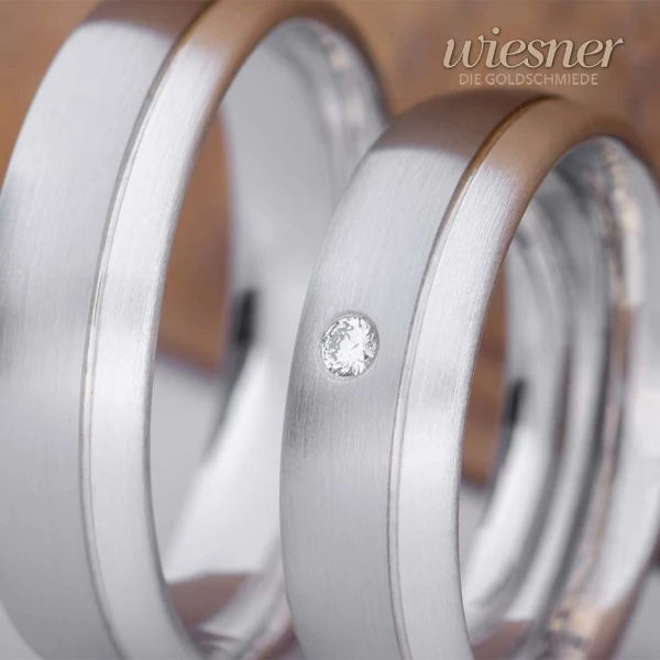 Trauringe aus Edelstahl mit Silber und Diamant – kontrastreiche Eleganz